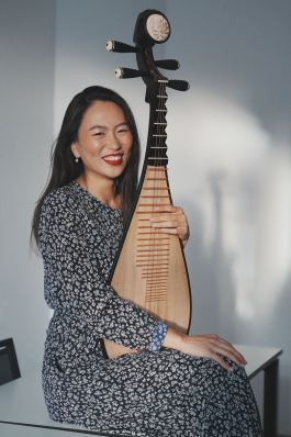 lucy-zhao-pipa-soloist 21 Portrait of Lucy Zhao holding the pipa and smiling towards the viewer